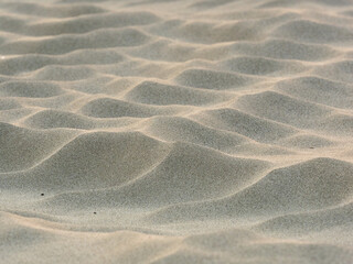 sand waves pattern created by the wind on the beach - 469813837