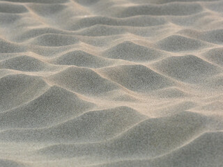 sand waves pattern created by the wind on the beach - 469813873