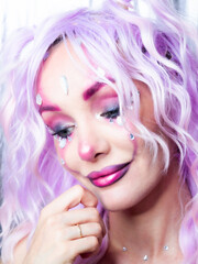 Girl with bright makeup and purple hair