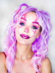 Girl with bright makeup and purple hair