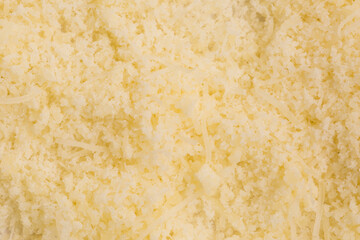 dry grated cheese background texture