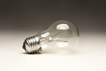 Clear glass incandescent filament bulb, analog technology