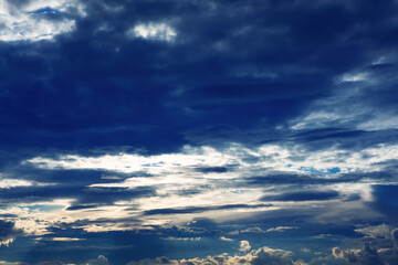 Blue clouds with sun beams