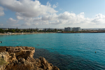 Fototapeta na wymiar Crystal clear blue water of Mediterranean sea on Nissi beach in Ayia Napa, Cyprus