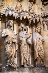 Obraz premium View in details on gothic Roman Catholic cathedral church Notre-Dame in central part of old French city Reims, France