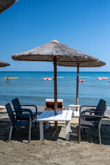 Beach unbrellas and chairs on sunny sandy beach Lady's mile in Akritori, Cyprus
