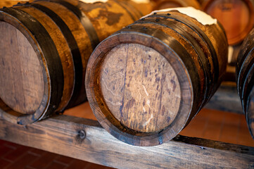 Traditional production and aging in wooden barrels of Italian Balsamic grapes vinegar dressing in Modena, Italy