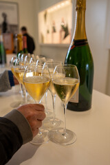 Tasting of brut champagne sparkling wine during visit caves in champagne house in Reims, France