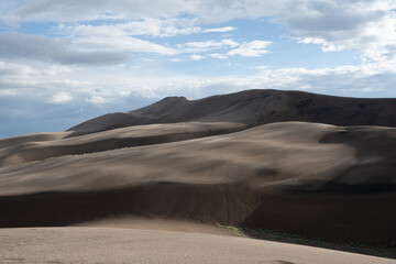 Clouds over the sand dunes on nice summer day