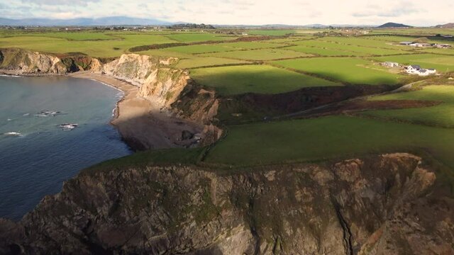 cliffs and meadows of the Cooper Coast Geopark, Waterford, Ireland.