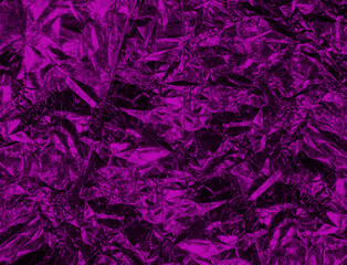 Texture of foil in velvet violet background. Purple trendy background.