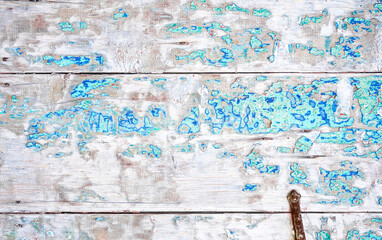 Crackled paint finish on white wood planks. Aged reclaimed barn wood.