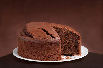 Chocolate sponge cake Brown background