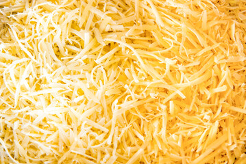 Grated cheese texture background, colonial cheese.