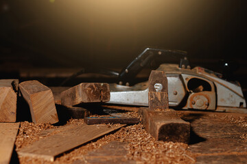 Close-up of a carpenter using a circular saw or a tool to cut wooden planks To make furniture in homes and residences, hotels, rooms made of wood.