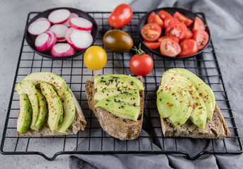  avocado toast with fresh vegetables  