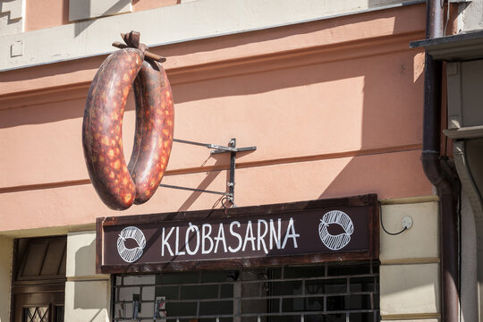 KRANJ, SLOVENIA - JUNE 14, 2021: Klobasarna, a typical slovenian shop selling kranjska klobasa, or carniolian sausage, a smoked sausage from Slovenia, from kranj, also called Krainer Wurst...
