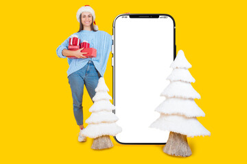 Cool mobile offer. Deuvushka near smartphone with white screen. Christmas template for advertising apps. Gadget with free layout space. Banner of Christmas apps. Woman and ate on yellow background