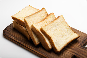 Fresh homemade  sliced bread on   wooden cutting board background