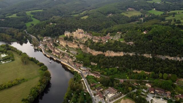 Aerial view of Beynac et cazenac france medieval small stone village in the dordogne forest wood land travel holiday famous destination