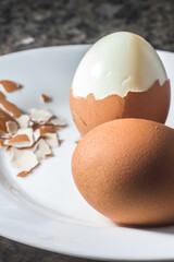 brown eggs with a hard-boiled egg between them, copy space and selective focus