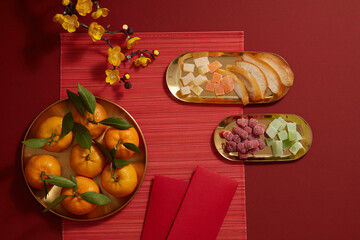 Chinese lunar new year with mandarin orange candy jam , fried potato , flower and ang pao biscuit...
