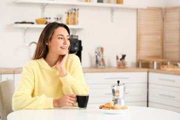 Morning of beautiful woman drinking coffee at home