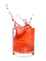 Glass of classic negroni cocktail with splashes on white background