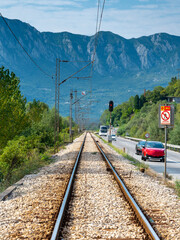 Railway tracks leading into a distant mountain landscape,Montenegro.