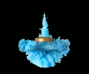 Jar of cosmetic product in blue smoke on black background