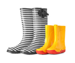 Different rubber rain boots isolated on white background