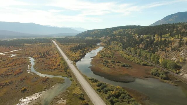 Aerial view of a scenic highway around mountains. East Kootenay, British Columbia, Canada.