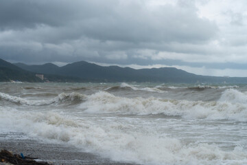 storm on the black sea, waves crashing on the shore, brown water