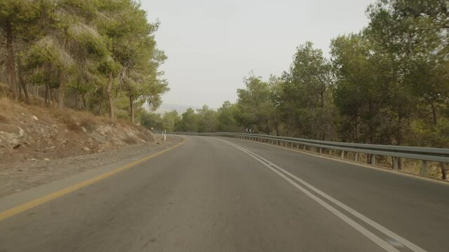 moving shot slow motion of empty desert forest road