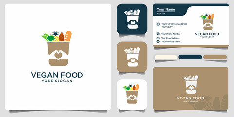 Grocery paper bag with food logo design and business card. Reusable product bag with healthy vegan vegan food vector design. - obrazy, fototapety, plakaty