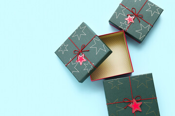 Green Christmas gift boxes on color background