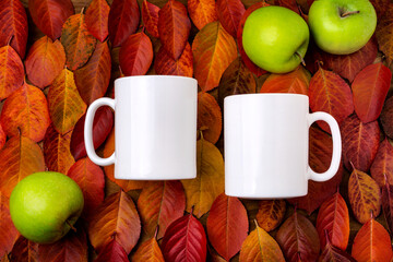 Two white coffee mug mockup with red leaves and apples background