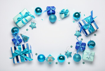 Frame made of Christmas gift boxes and balls on white background