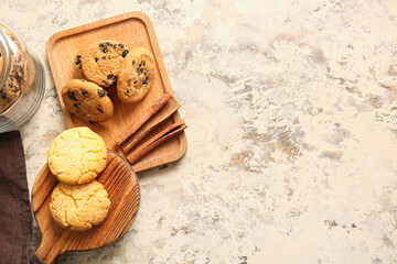 Wooden boards with tasty homemade cookies on beige background