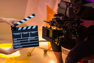 Man hands holding movie clapper. Film director concept. Behind the scenes of movie shooting or...