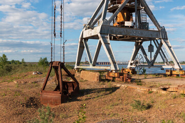 harbor crane bucket lowered to the ground