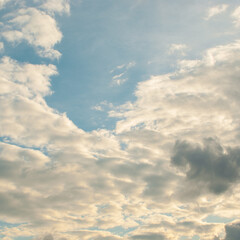Background sky blue with filled fluffy natural clouds and natural sunlight.The atmosphere in summer