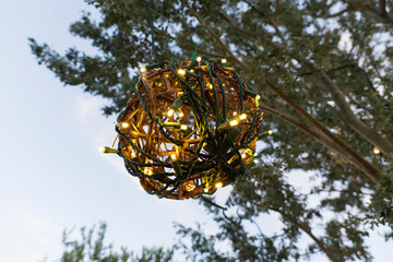 christmas ball ornament hanging from a tree