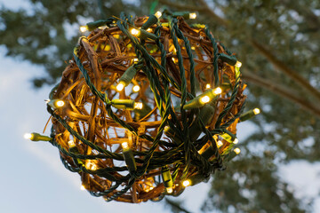 golden christmas ball ornament lit with lights