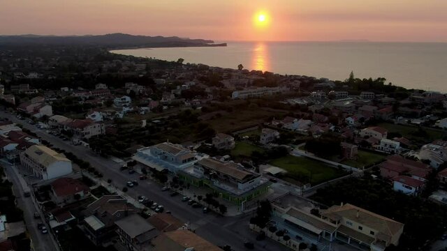 drone view of ttraditional village of acharavi in north corfu greece with sunset