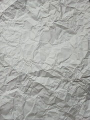 white crumpled paper texture background.