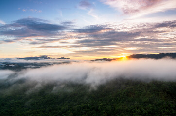 Beautiful aerial view sea of fog in the morning forest mountent with green mountains. Nong Ya Plong, Phetchaburi, Thailand