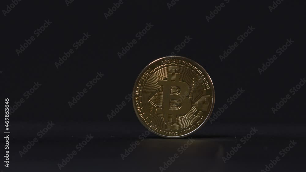 Poster bitcoin single isolated coin with copy space over a black background
