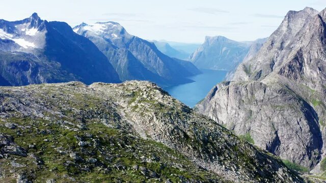 Summit Of Katthammaren Mountain And The Narrow Lake Of Eikesdalsvatnet In More Og Romsdal, Norway. aerial