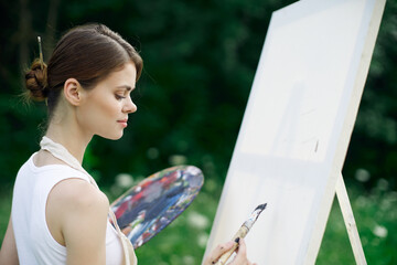 woman artist nature paints palette easel creative landscape